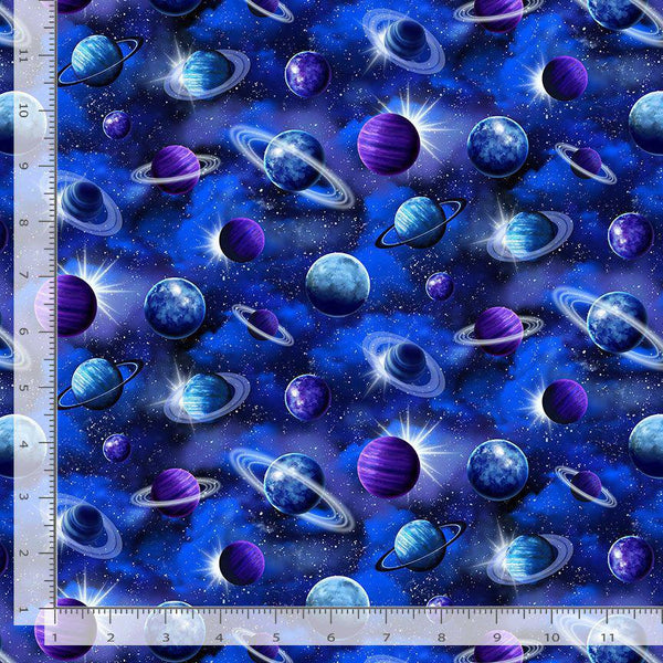 Space-themed fabric with planets and stars, featuring a ruler for scale.