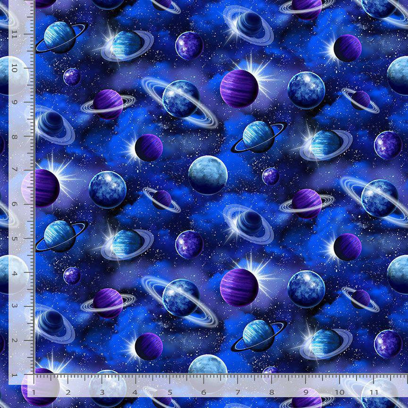Space-themed fabric with planets and stars, featuring a ruler for scale.
