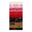 A package of 40 2.5" x 44" strips of batik fabric from Timeless Treasures. They feature prints in green, red, pink, and cream. 