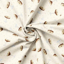 Fabric with a pattern of martini glasses on a beige background