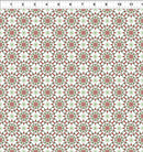 Patterned fabric with red and green geometric design on a white background, measured against a ruler.